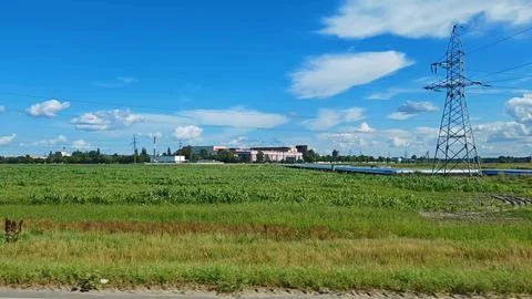 Side view of power lines in the countryside from a car window Stock Photos