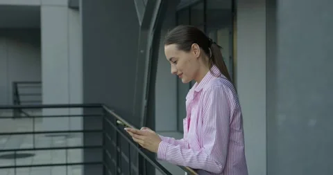 Side view of pretty woman using cell phone outdoors Stock Footage 158759999