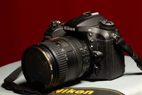 Side view of a professional DSLR camera from Nikon D7100 with 16-85mm f/3.5.. Stock Photos