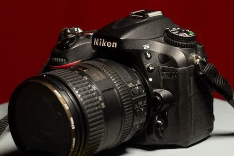 Side view of a professional DSLR camera from Nikon D7100 with 16-85mm f-3.5.. Stock Photos
