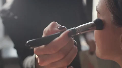 Side view of a professional make-up artist at work. Close-up Stock Footage 54635642