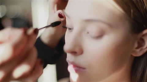 Side view of professional mascara application with a brush Stock Footage 54636823