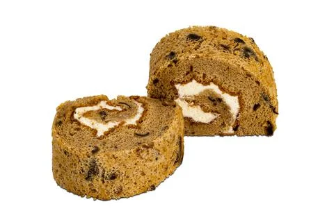 Side view of prune sponge cake roll isolated on white background. Stock Photos