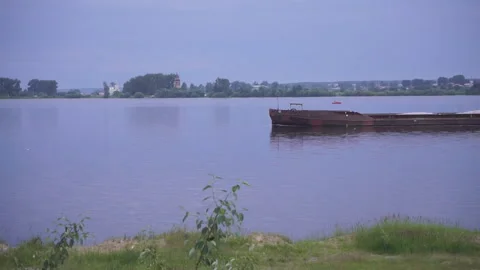 Side view of red cargo ship floating in the sea Slow motion Video stock 95033147