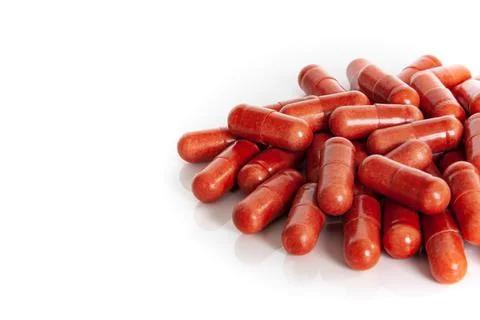 Side view of red multivitamin supplements detail Stock Photos