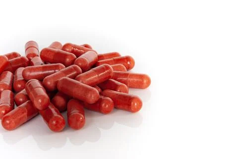 Side view of red multivitamin supplements Stock Photos
