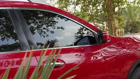 Side View Red SUV Parked Outdoors Stock Footage 334743414