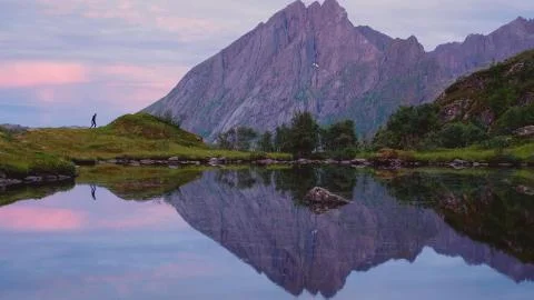 Side view of a reflection of a mountain in a lake Stock Photos