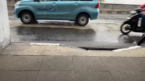 Side view of road in jakarta while rain Stock Footage 287314941