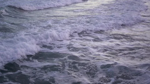 Side view from the rocks. Late afternoon. Waves breaking hard 스톡 동영상 131865524