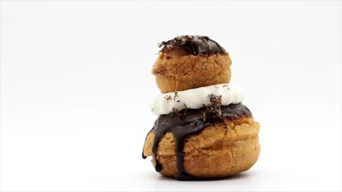 Side View Of A Rotating Gourmet Savoury Religieuse On A White Background, UK Stock Footage 153501155
