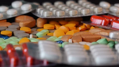 Side View - Rotating Pills and Blister Packs - Shallow DOF - Medicine  v1 Stock Footage 331088730