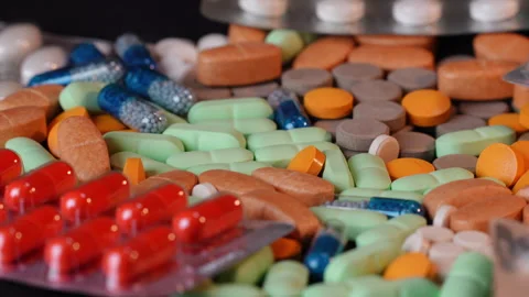 Side View - Rotating Pills and Blister Packs - Shallow DOF - Medicine  v2 Stock Footage 331088904