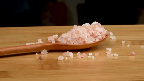 Side View Rotating Pink Salt On Wooden Spoon Background Stock-Footage 331853398