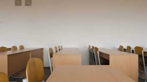 Side view of rows desks and chairs in lecture hall. Slider equipment used. Stock Footage 91900670