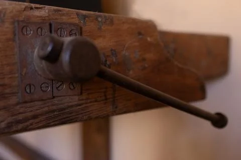Side view of a rusted mortise on an old carpenter's table.Craftsmanship. Stock Photos