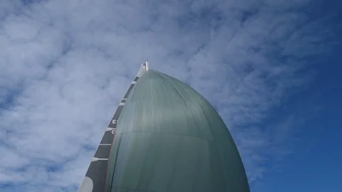 Side view of a sail boat with a full sail.  Stock Footage 82459761