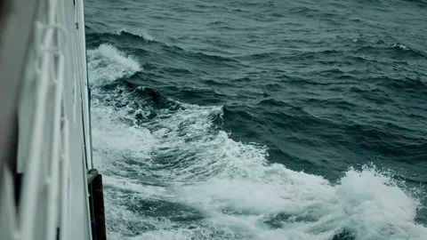Side View of Sailing Ship with Choppy Ocean Waves and White Foam Trails Stock Footage 315094304