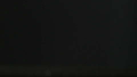 Side-view of salt / granular substance bouncing off of a table. White Vidéo 111464036