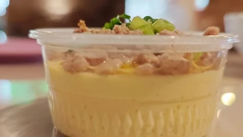 Side View of Savory Steamed Egg Custard with Pork. Stockbeeldmateriaal 340077875