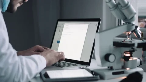 Side view of scientist working on laptop Video stock 70846854