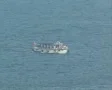Side view of ship moving through water SD Footage