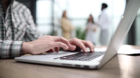 Side view shot of businessman working by using a laptop computer on table. Stock Footage 244175072