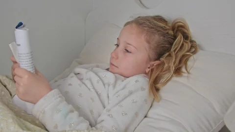 Side view of a sick little cute caucasian girl Stock Footage 126792515