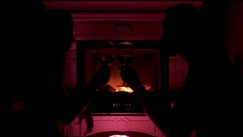 Side view silhouette of couple with two goblet of wine clink glasses and Stock Footage 103548948