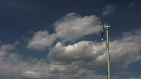 Side view of single windmill against blue sky Stock Footage 407720