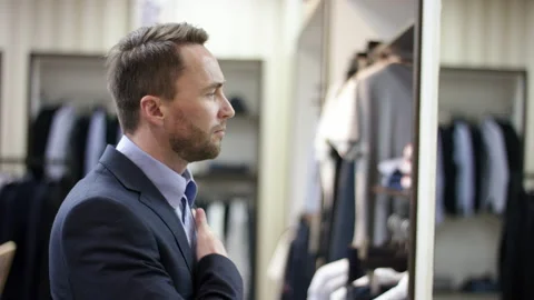 A side view slow motion close uo video of a dark haired business man standing in Stock Footage 137607235