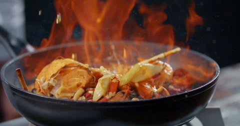 Side View Slow Motion Flambe Shrimp and Crab Shell Video stock 132848424