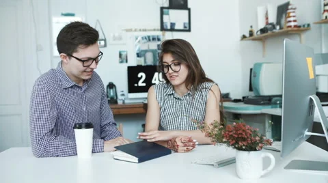 Side view of smiling business colleagues working on laptop Stock Footage 62835837