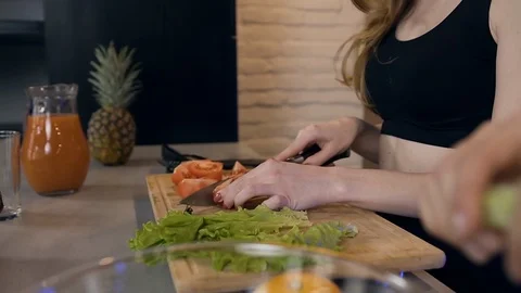 Side view of smiling good-natured young brunette and blondie which preparing Stock Footage 127105829