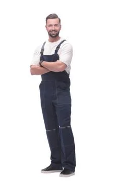 Side view. smiling man in overalls looking forward to copy space Stock Photos