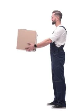 Side view. smiling man passing a cardboard box Stock Photos