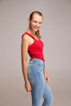 Side view of smiling model looking at camera Stock Photos