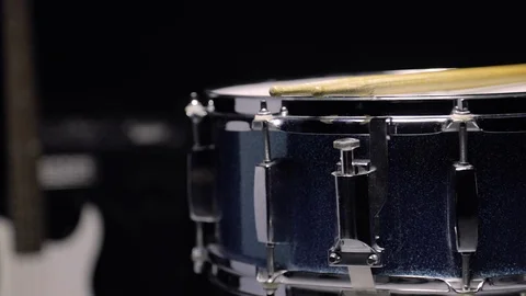 The side view of snare drum in the dolly shot with black background. Stock Footage 103604239