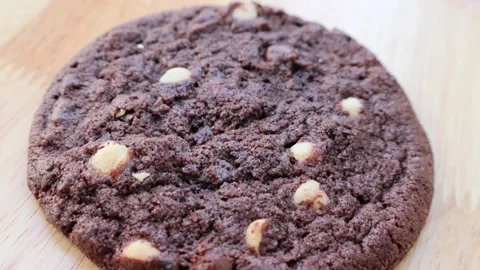 Side view soft Chocolate Cookie with chocolate chips on wooden board Stock Footage 298553715
