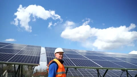 Side view of solar power station engineer in uniform Stock Footage 168178500