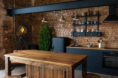 Side view of spacious industrial loft kitchen and living room with vintage de Stock Photos