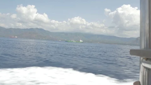 Side view of Speedboat passing by Bali 動画素材 90654875