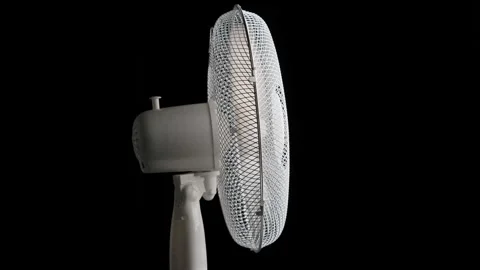 Side view of spinning floor fan loop Stock Footage 344692002