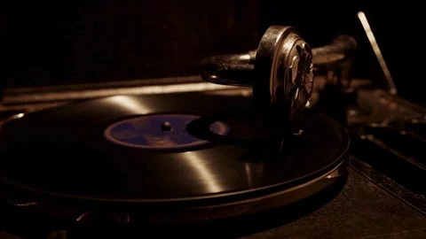 Side view of spinning record on a vintage gramophone Stock Footage 329559332