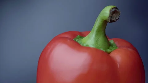 Side View of Spinning Red Pepper on Dark Background Video stock 330941867