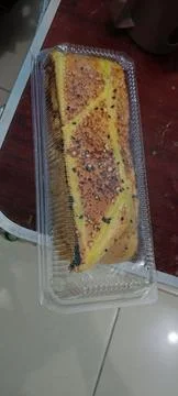 Side view of sponge cake with chocolate filling and melted cheese Stock Photos