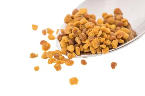 Side view of spoon with bee pollen, white background 스톡 사진