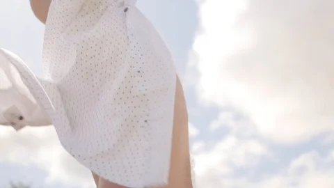 Side view of a standing man and spreading his arms against the background of Stock Footage 113279417