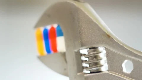 Side view of the standing wrench on the white table Stock Footage 129862846