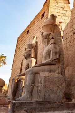 Side view statue of Pharaoh Ramses II at the entrance to the famous Luxor Tem Stock Photos